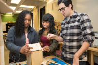 A teacher helps two engineering students build a butterfly house. Photo by Allison Shelley/The Verbatim Agency for American Education: Images of Teachers and Students in Action