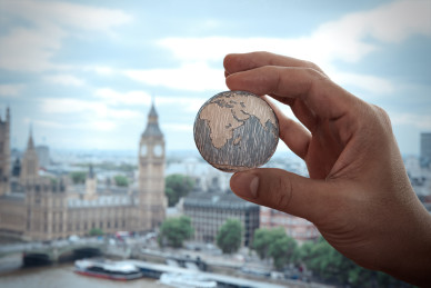 close up of businessman hand showing texture the world - Elements of this image furnished by NASA london city background