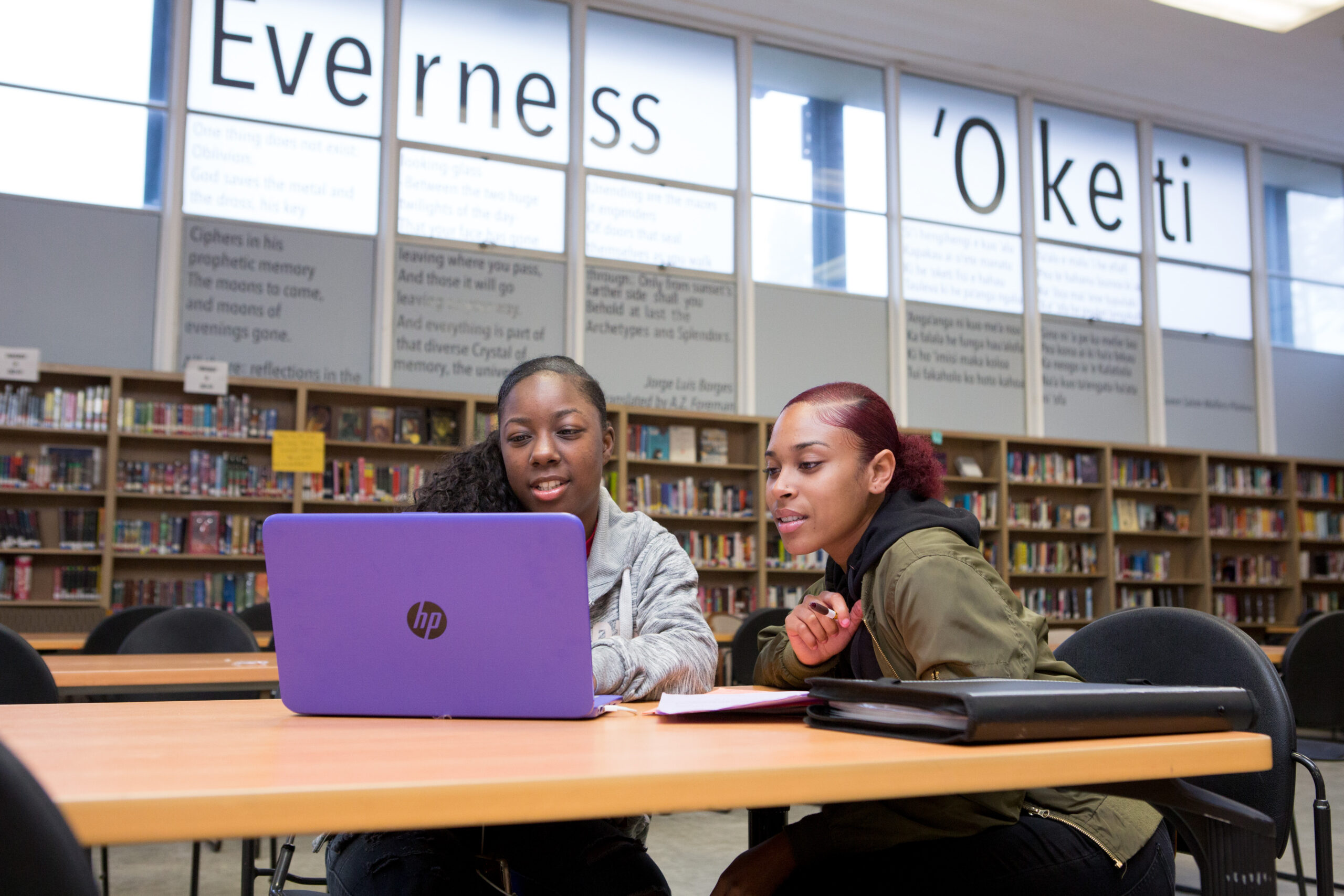 Two high school girls at computer in library Deeper learning environments give students more responsibility for their own learning while helping them develop real-world knowledge and skills.