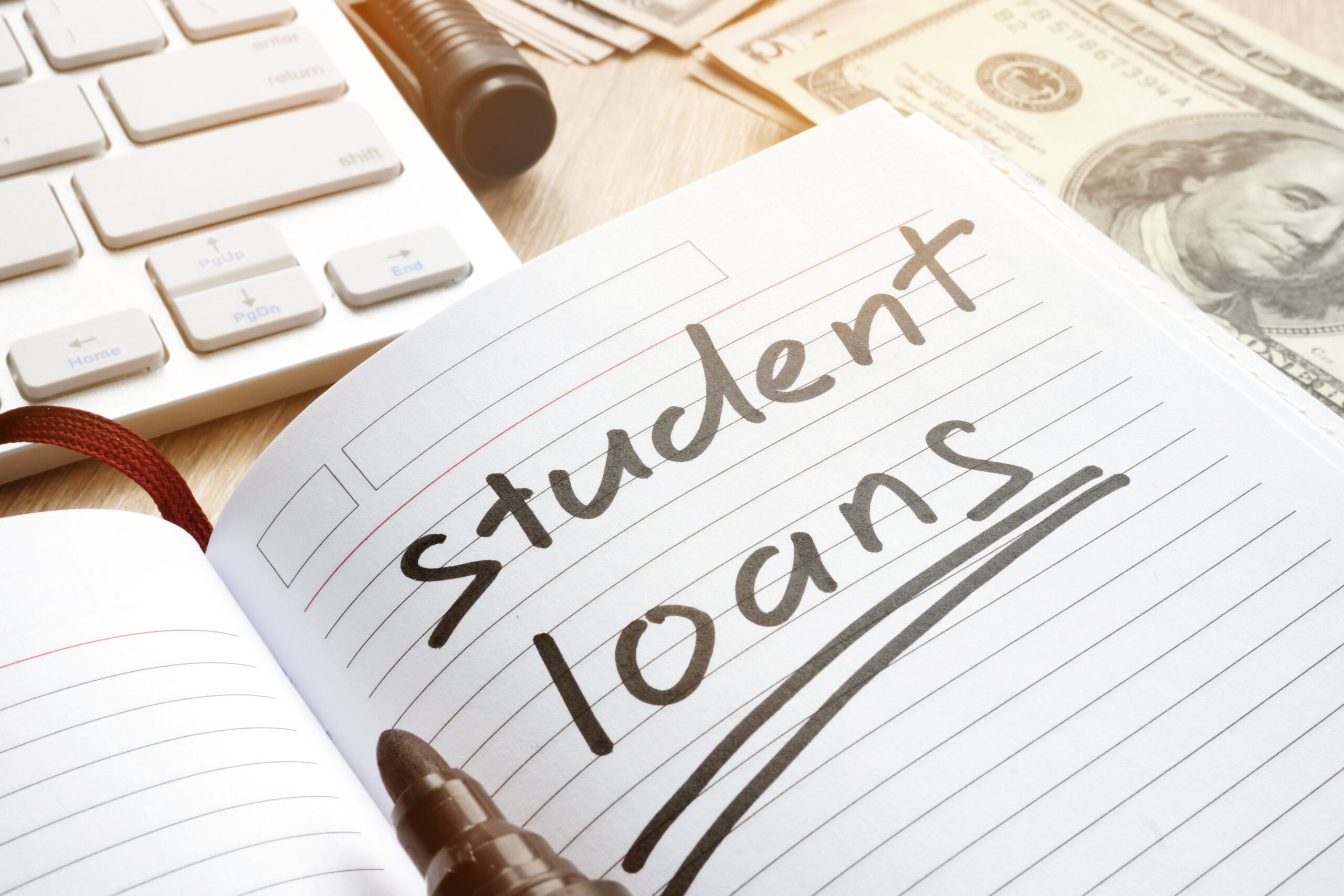Student loan handwritten in a note. Money for education. Student loan handwritten in a note. Money for education.