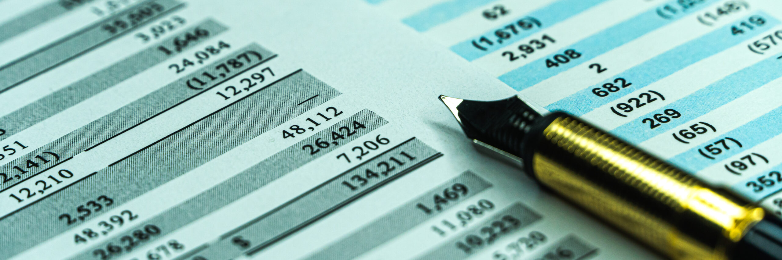 Financial business planning, Balance the investment portfolio. Balance sheet of a financial report with fountain pen. Wide banner